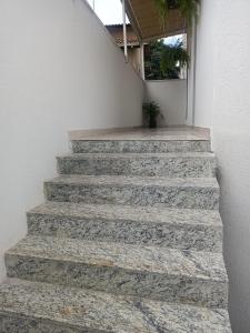a set of stone stairs with a potted plant at Recanto Trevo da Pampulha in Belo Horizonte