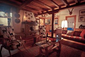 a living room with a couch and a table at Chaletbethere in Pila