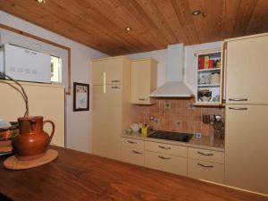 a kitchen with a vase sitting on a table at Appartement 75m², 8 pers., proche télésiège, Vieil Alpe - Alpe d'Huez - FR-1-405-132 in L'Alpe-d'Huez +2 photos
