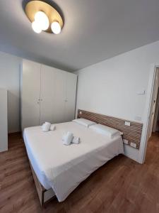 Postel nebo postele na pokoji v ubytování Residenza Urania