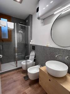 a bathroom with a toilet and a sink and a shower at Residenza Urania in Venice