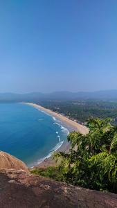 a view of a beach with the ocean at Santana Guest House in Agonda