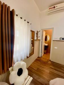 a living room with a large white pillow on the floor at Nhật Quang House in Da Nang