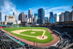 a baseball game in a stadium with a city at Charming 1BR Condo - Full Kitchen - Uptown Living in Charlotte