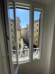 a window with a view of a city at Casetta Beatrice Tivoli Holiday Home (British) in Tivoli