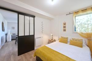 Postel nebo postele na pokoji v ubytování Ellanoa - Joli appartement avec vue montagne