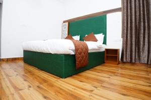 Postel nebo postele na pokoji v ubytování RICHBERRY- A Premium Plantation Villa's