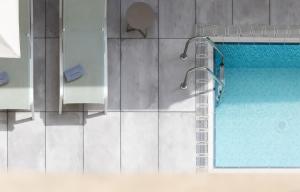 an overhead view of a swimming pool in a building at Catalonia Diagonal Centro in Barcelona