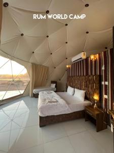 a bedroom with a bed in a tent at Rum city Star LUXURY Camp in Wadi Rum