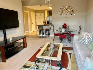 a living room with a couch and a table at Midtown Oasis by Luxe One -S57 in Atlanta