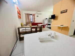 a room with a kitchen and a living room at Suite Orizzonte - Sanremo in Sanremo
