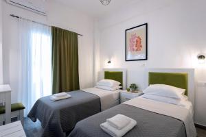 Postel nebo postele na pokoji v ubytování Alkinoos by Anita Holiday Homes