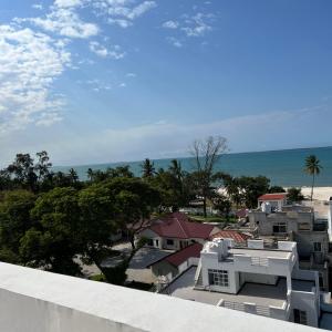 a view of the beach from the roof of a house at En-Suite Rooms W/Pool & Gym in Mikocheni Near Beach in Dar es Salaam