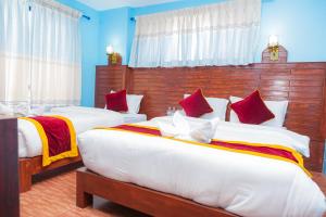 Hotel The Billabong Garden Pokhara 객실 침대