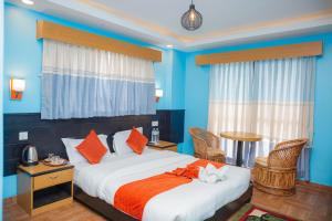 Hotel The Billabong Garden Pokhara 객실 침대