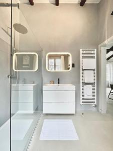 a bathroom with a sink and a mirror at Charming loft in Venetian Villa in Noale