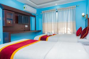 Hotel The Billabong Garden Pokhara 객실 침대