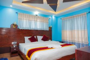 Hotel The Billabong Garden Pokhara 객실 침대