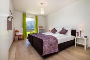 Ένα ή περισσότερα κρεβάτια σε δωμάτιο στο Berghaus Flachau
