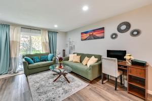 a living room with a couch and a table at San Diego Condo Pool Access, 8 Mi to Downtown in San Diego