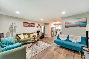 a living room with a couch and a table at San Diego Condo Pool Access, 8 Mi to Downtown in San Diego