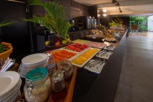 a buffet line with many different types of food at Armação dos Búzios Pousada Design in Búzios
