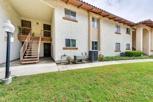 a building with a staircase and a grass yard at San Diego Condo Pool Access, 8 Mi to Downtown in San Diego