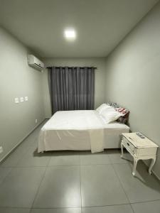 Postel nebo postele na pokoji v ubytování Edifício Madrid | Ayrton Senna
