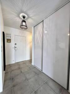 a room with a hallway with a door and a ceiling at !NEW! Disney/Paris - 50m RER A in Noisy-le-Grand
