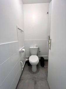 a bathroom with a white toilet in a stall at !NEW! Disney/Paris - 50m RER A in Noisy-le-Grand