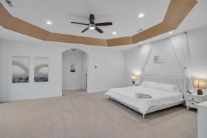 a white bedroom with a white bed and a ceiling at Bull Run Estate- Luxury Retreat with Scenic Views home in Haymarket