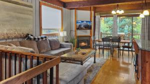 a living room with a couch and a fireplace at Cozy 2 BR Condo in Town Walk to Main St Skiing in Breckenridge