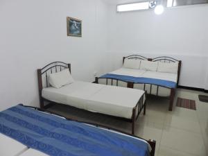 Letto o letti in una camera di Charlton Kandy City Rest