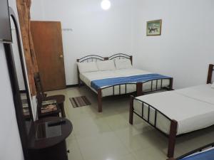 Letto o letti in una camera di Charlton Kandy City Rest