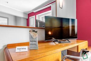TV a/nebo společenská místnost v ubytování HOTIDAY Room Collection - Sauze Torre