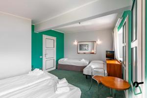 Postel nebo postele na pokoji v ubytování HOTIDAY Room Collection - Sauze Torre