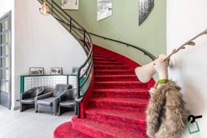 Posezení v ubytování HOTIDAY Room Collection - Sauze Torre
