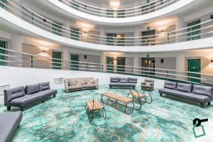 Posezení v ubytování HOTIDAY Room Collection - Sauze Torre