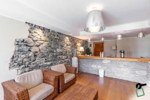 Posezení v ubytování HOTIDAY Room Collection - Sauze Torre
