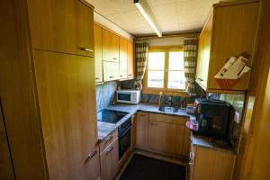 Kuchyň nebo kuchyňský kout v ubytování Haus Chalet Beverin