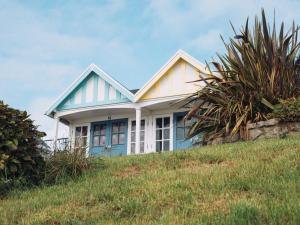 a house on top of a hill at The Loft - A Stylish Holiday Property in Weymouth with Sea View and Parking in Weymouth