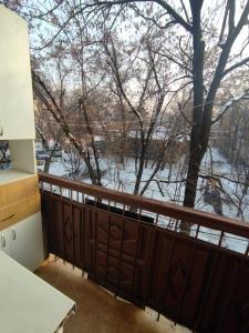 a balcony with a view of a river at 1 комнатные апартаменты в районе Атакента in Almaty