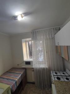 Posteľ alebo postele v izbe v ubytovaní 1 комнатные апартаменты в районе Атакента