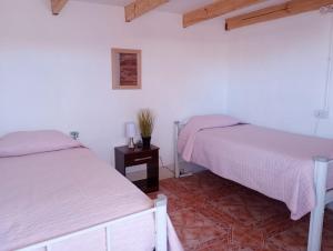 Voodi või voodid majutusasutuse Pirca Hostal toas