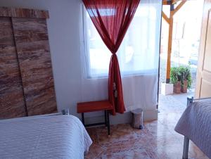 Voodi või voodid majutusasutuse Pirca Hostal toas