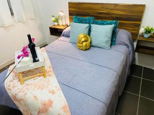 a yellow teddy bear sitting on top of a bed at Departamento centrico - Bufa House in Guanajuato