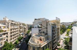 an aerial view of a city with buildings at Charming Green Studio across the National Museum in Athens