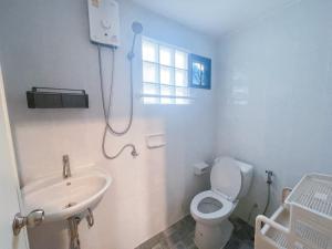 a bathroom with a shower and a toilet and a sink at Patong Beach - Private Pool Villa in Patong Beach