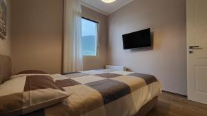 Giường trong phòng chung tại COSTA PARADISE