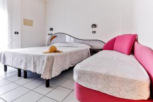 Postel nebo postele na pokoji v ubytování Hotel Rondinella